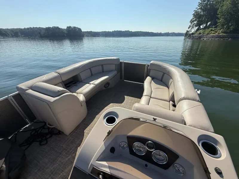 Slide: The Image of Harris Cruiser 230 pontoon boat on calm water, 2021 model. - 17