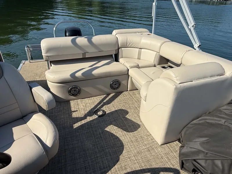 Slide: The Image of Interior of a 2021 Harris Cruiser 230 pontoon boat on the water. - 18