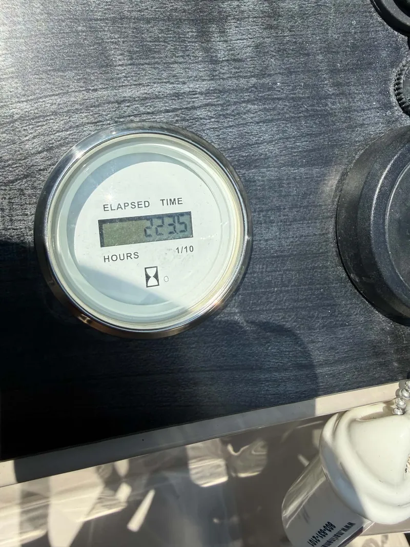 Slide: The Image of Hour meter on Harris Cruiser 230, displaying 223.5 hours. - 2