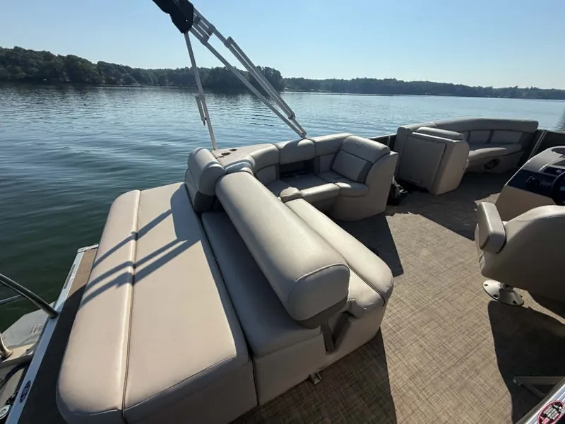 Slide: The Image of Harris Cruiser 230 pontoon boat on calm water, year 2021. - 20