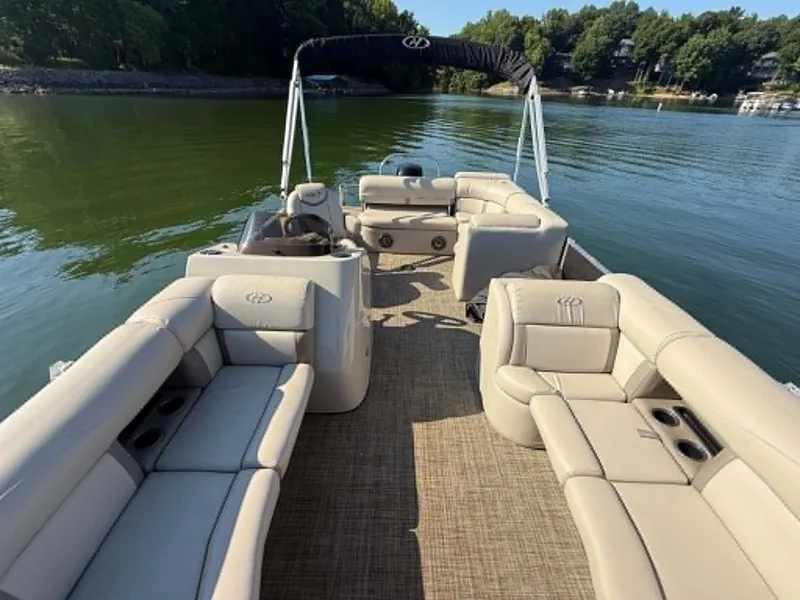Slide: The Image of Harris Cruiser 230 pontoon boat on calm lake, 2021 model. - 21