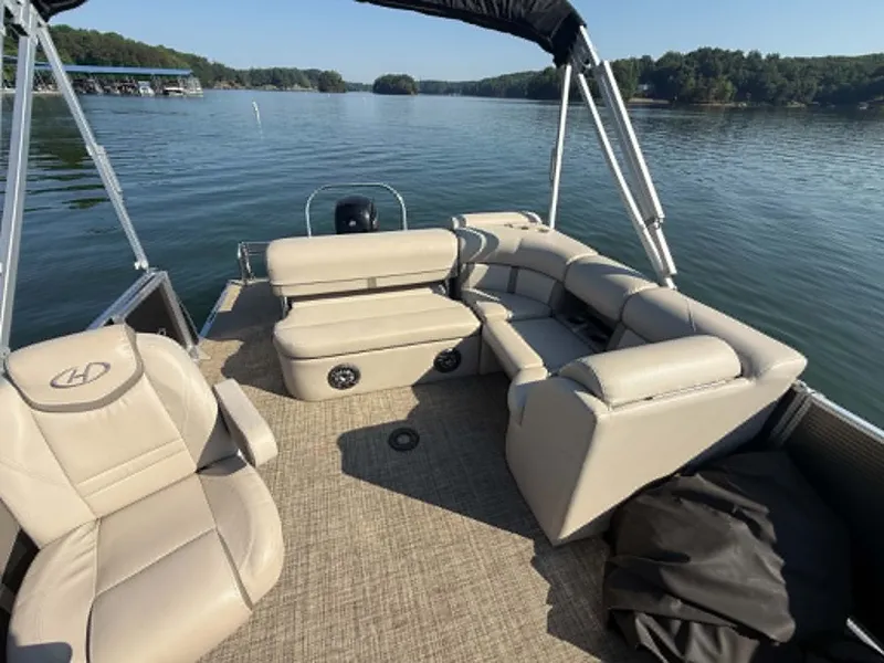 Slide: The Image of Harris Cruiser 230 pontoon boat on a calm lake, year 2021. - 7