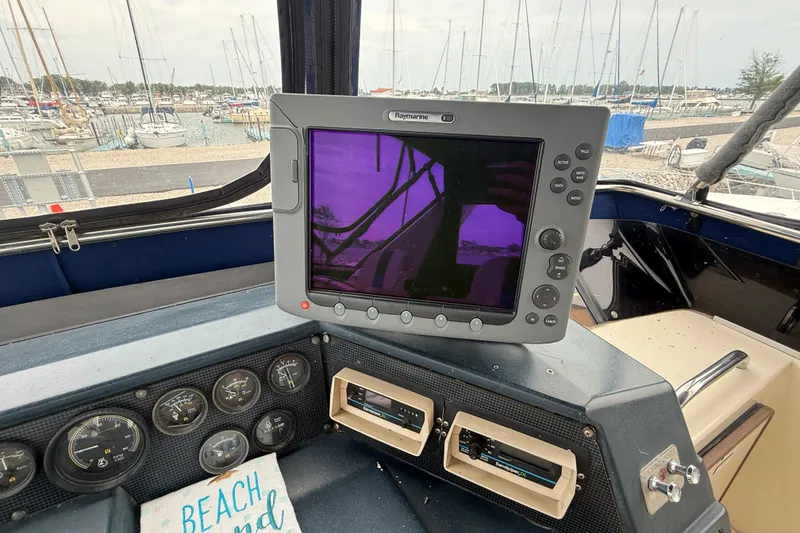 Slide: The Image of Control panel of a 1986 Sea Ray 410 Aft Cabin with navigation equipment. - 24