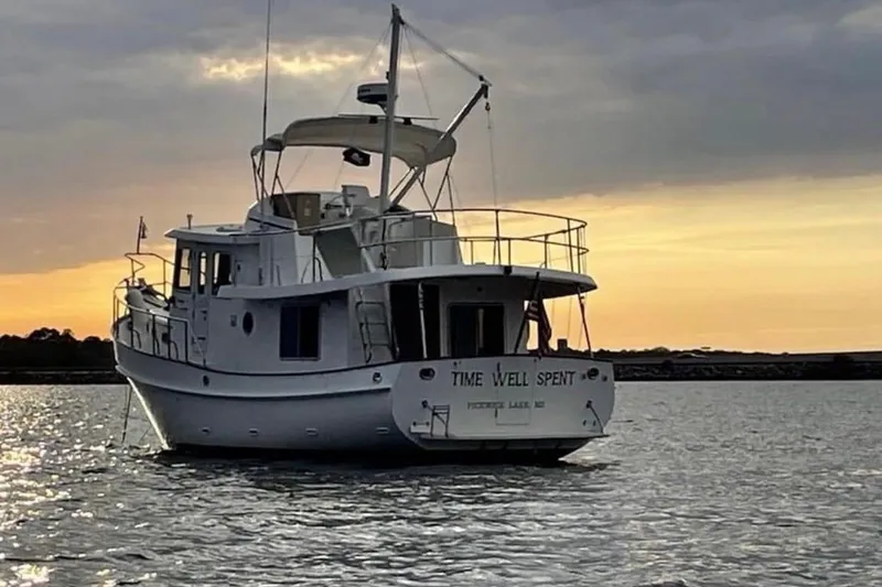 The Image of Kadey-Krogen 39 yacht from 2001 on calm water at sunset. - 0
