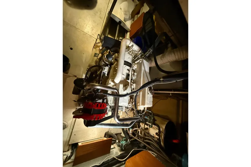 Slide: The Image of Engine compartment of a 2001 Kadey-Krogen 39 boat, showcasing mechanical components. - 29