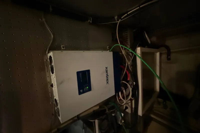 Slide: The Image of Electrical system inside a 2001 Kadey-Krogen 39 boat, featuring a Xantrex inverter. - 31