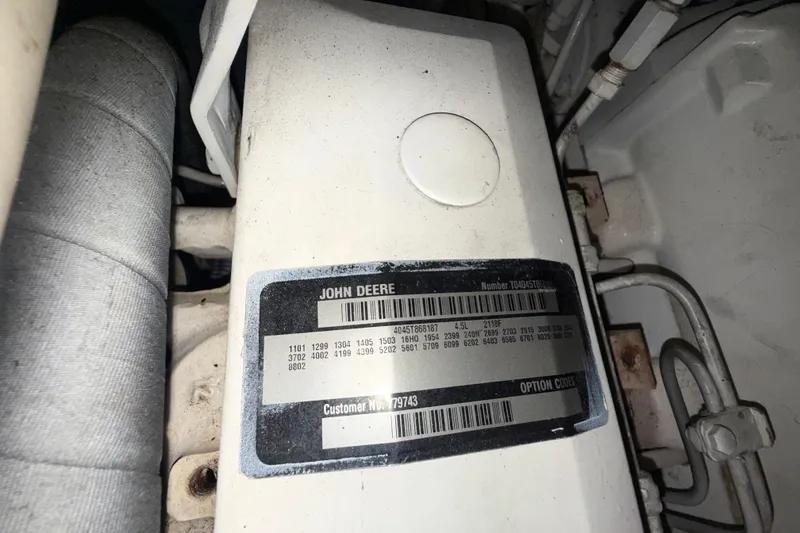 Slide: The Image of Engine label on a 2001 Kadey-Krogen 39, featuring John Deere specifications and codes. - 35