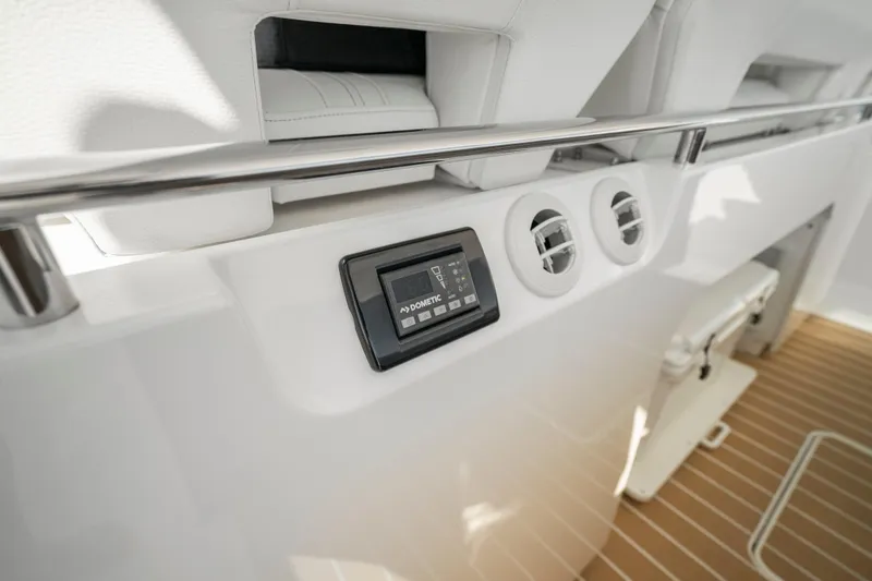 Slide: The Image of 2024 Tiara Yachts 43 LS interior detail with control panel and air vents. - 24