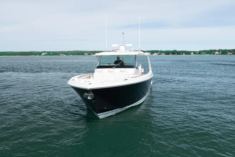 Slide: The Image of 2024 Tiara Yachts 43 LS cruising on calm waters, showcasing sleek design and luxury. - 3