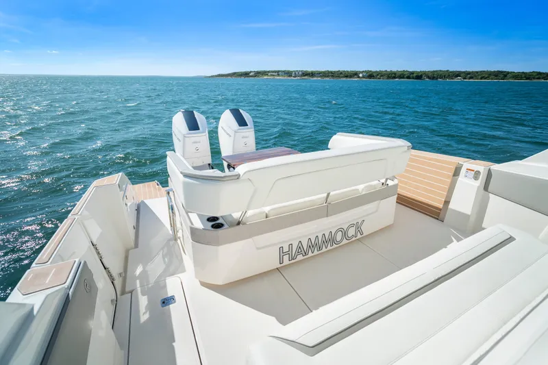 Slide: The Image of 2024 Tiara Yachts 43 LS boat with dual engines on open water. - 32
