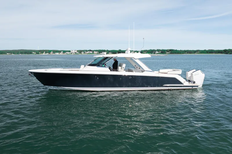 Slide: The Image of 2024 Tiara Yachts 43 LS luxury boat cruising on calm waters. - 50