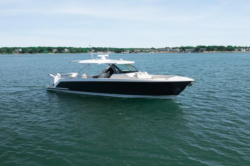 Slide: The Image of 2024 Tiara Yachts 43 LS luxury boat cruising on calm waters. - 59