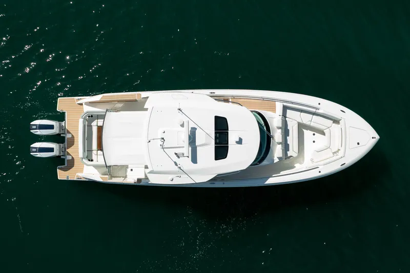 Slide: The Image of Overhead view of 2024 Tiara Yachts 43 LS on water, showcasing sleek design and twin engines. - 60