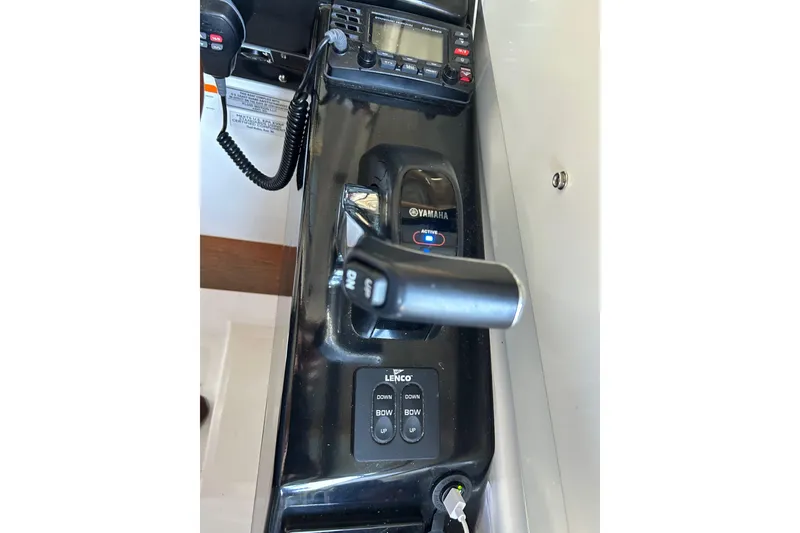 Slide: The Image of Control panel of a 2017 Cutwater C-24 boat featuring Yamaha throttle and Lenco trim tabs. - 14