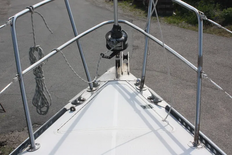 Slide: The Image of Bow of 1981 S2 9.2A sailboat with stainless steel railings and winch. - 10