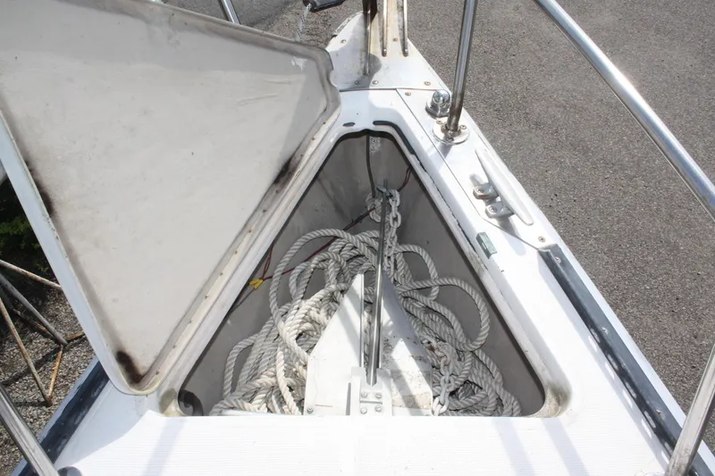 Slide: The Image of Anchor locker of 1981 S2 9.2A sailboat with coiled ropes inside. - 11