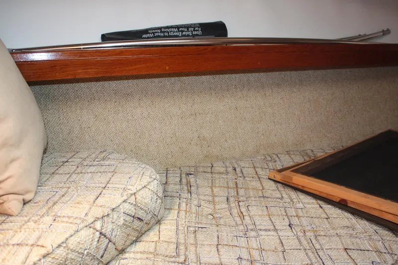 Slide: The Image of Interior cabin of 1981 S2 9.2A sailboat with cushioned seating and wooden trim. - 18