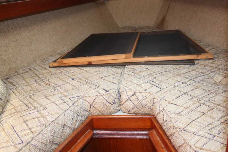 Slide: The Image of Interior cabin of 1981 S2 9.2A sailboat with patterned cushions and wooden accents. - 19