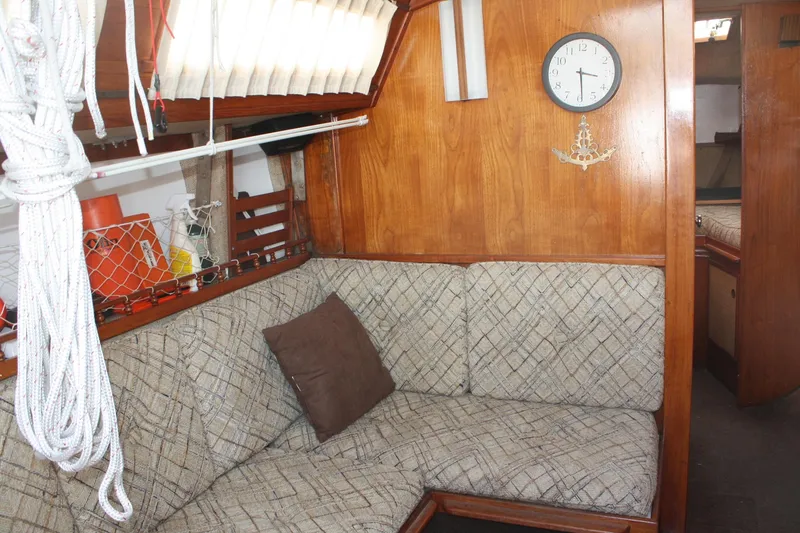 Slide: The Image of Interior of 1981 S2 9.2A sailboat with cozy seating and nautical decor. - 26