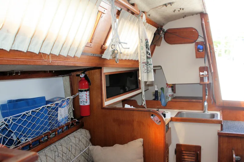 Slide: The Image of Interior of 1981 S2 9.2A sailboat with kitchenette and storage area. - 31