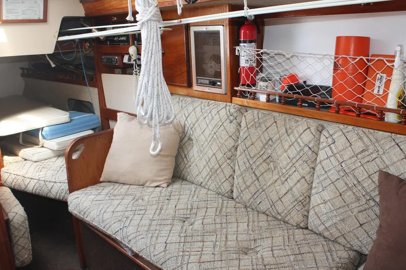 Slide: The Image of Interior of 1981 S2 9.2A sailboat with patterned seating and nautical equipment. - 33