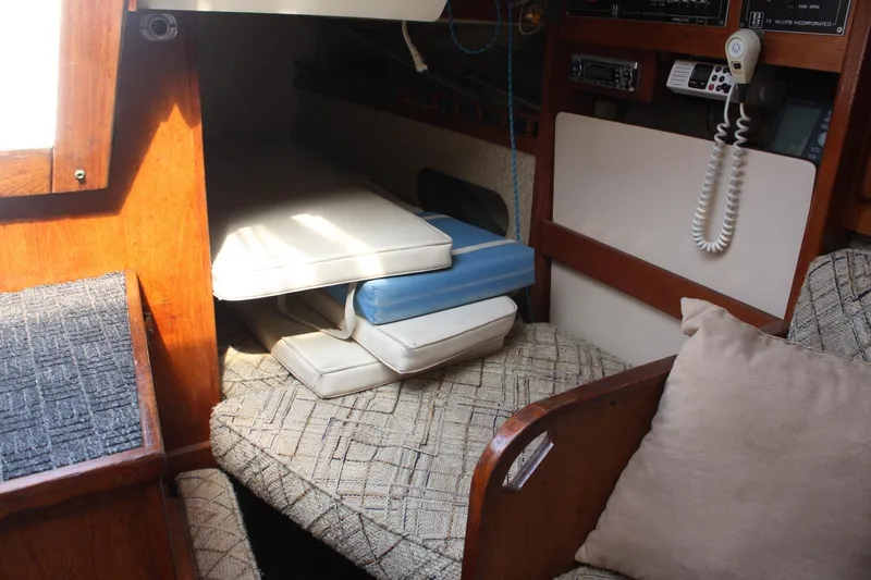 Slide: The Image of Interior of 1981 S2 9.2A sailboat with cushions and communication equipment. - 34