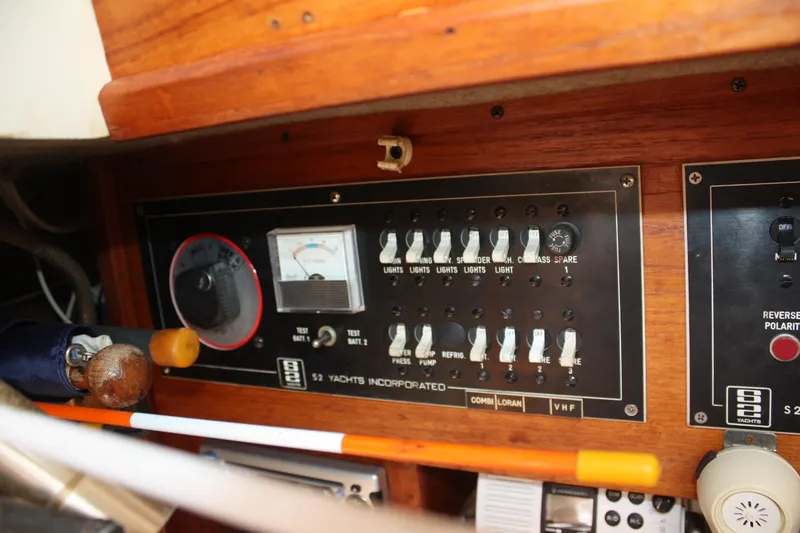 Slide: The Image of Electrical control panel of a 1981 S2 9.2A yacht with switches and gauges. - 39