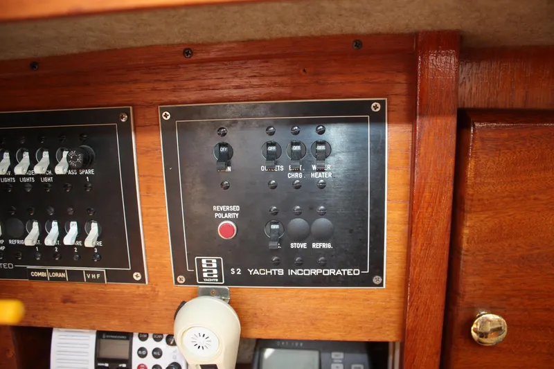 Slide: The Image of Electrical panel of a 1981 S2 9.2A yacht, featuring switches and controls. - 40