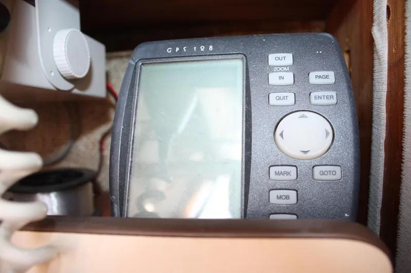 Slide: The Image of 1981 S2 9.2A boat GPS device with navigation controls and display screen. - 42
