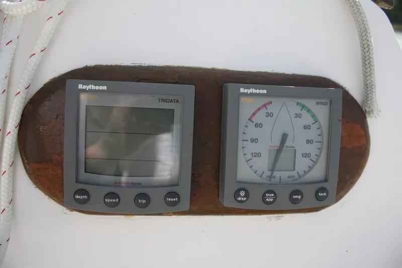 Slide: The Image of Raytheon marine instruments on 1981 S2 9.2A sailboat, displaying wind and depth data. - 44