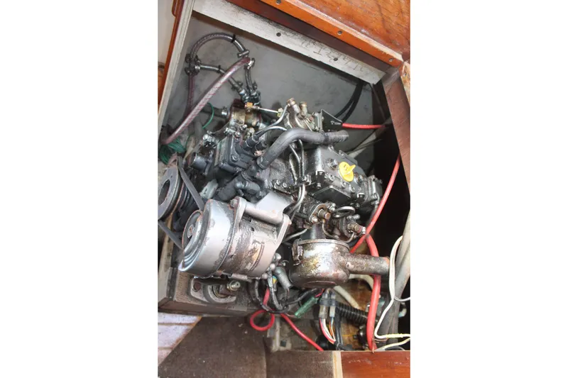 Slide: The Image of Engine compartment of a 1981 S2 9.2A sailboat, showing mechanical components and wiring. - 45