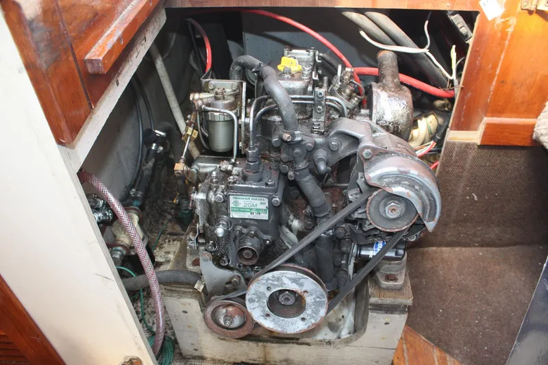 Slide: The Image of Engine compartment of a 1981 S2 9.2A sailboat, featuring a Yanmar diesel engine. - 47