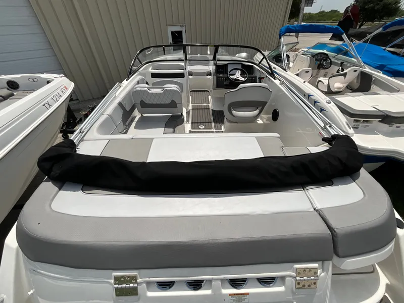 Slide: The Image of The image shows the cockpit of a 2023 Bayliner VR5 with gray seating and a modern helm. - 5