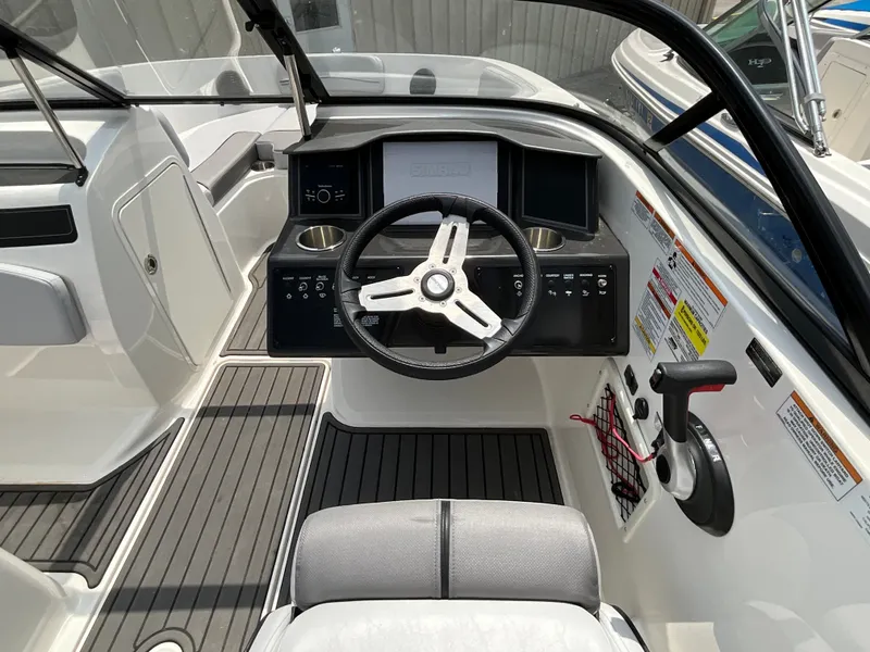 Slide: The Image of The image shows the cockpit of a 2023 Bayliner VR5 with a modern helm station. - 10