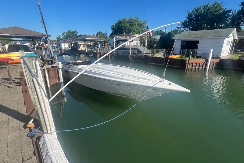 Slide: The Image of 1994 Fountain 42 Lightning boat docked in a serene marina setting. - 1