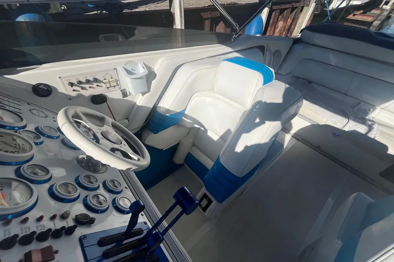 Slide: The Image of Cockpit of a 1994 Fountain 42 Lightning boat with steering wheel and control panel. - 13