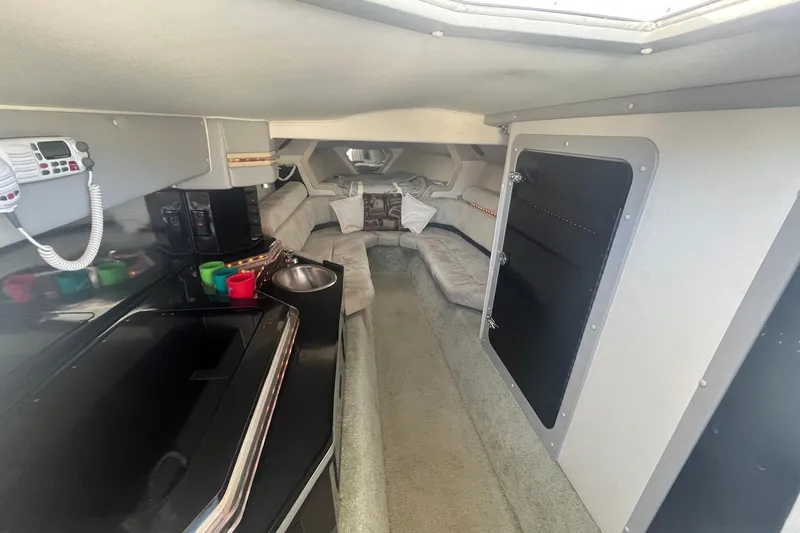 Slide: The Image of Interior of a 1994 Fountain 42 Lightning boat with seating and kitchenette. - 17