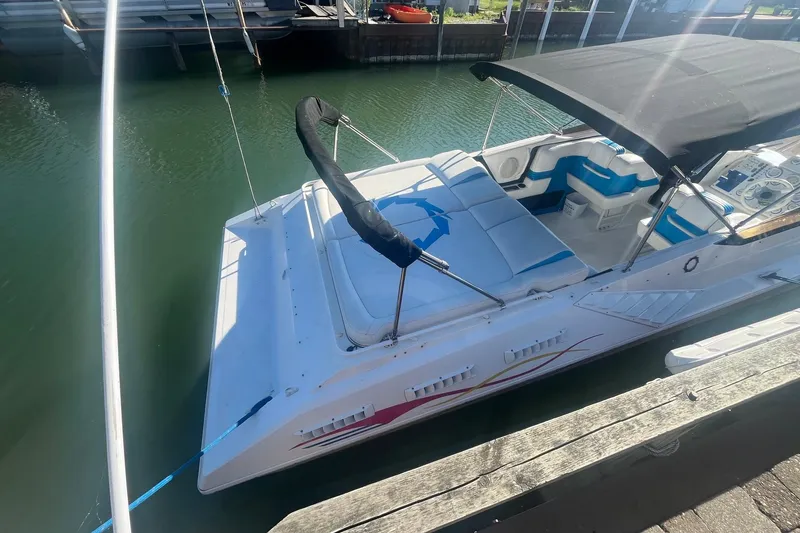 Slide: The Image of 1994 Fountain 42 Lightning boat docked, featuring sleek design and comfortable seating. - 2