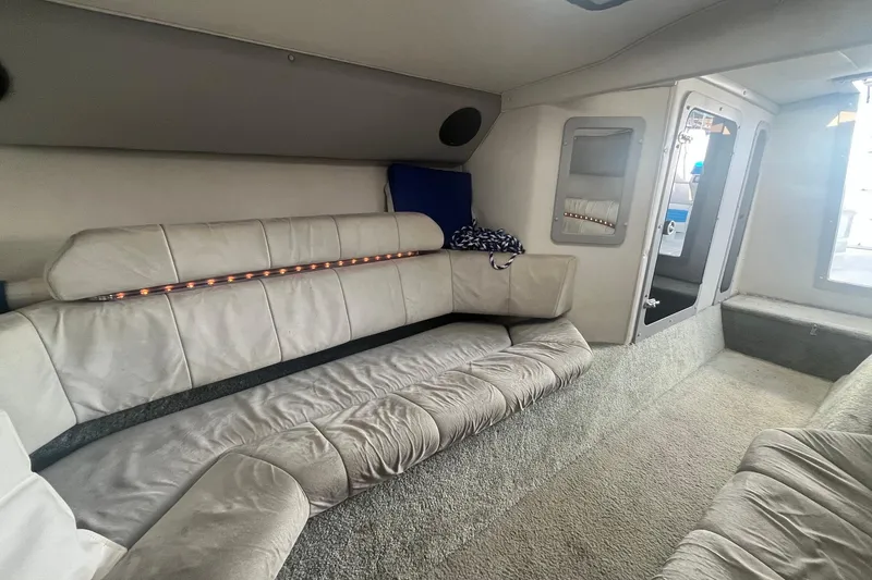 Slide: The Image of Interior of a 1994 Fountain 42 Lightning boat with plush seating and carpeted flooring. - 27