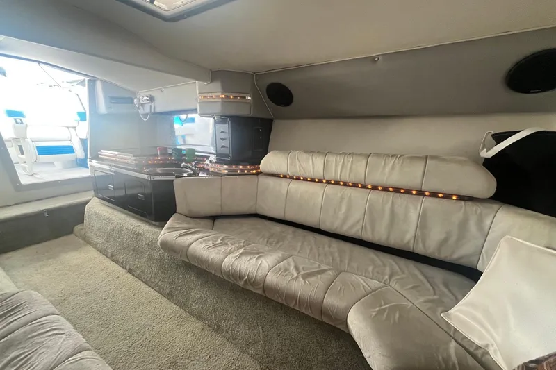 Slide: The Image of Luxurious interior of a 1994 Fountain 42 Lightning boat with plush seating and ambient lighting. - 28