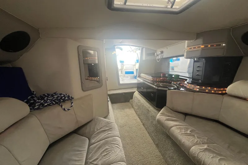 Slide: The Image of Interior of a 1994 Fountain 42 Lightning boat, featuring plush seating and modern amenities. - 29