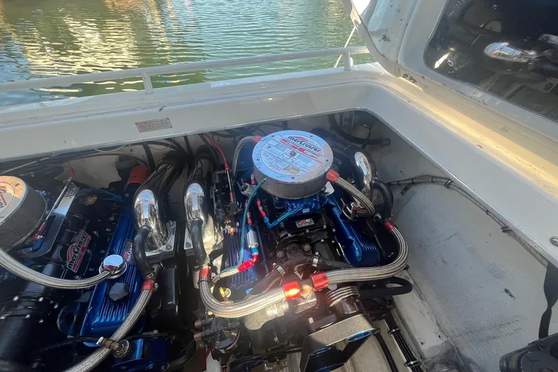 Slide: The Image of Engine compartment of a 1994 Fountain 42 Lightning boat with visible components. - 31