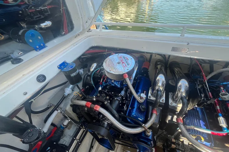 Slide: The Image of Engine compartment of a 1994 Fountain 42 Lightning boat, showcasing detailed components. - 32