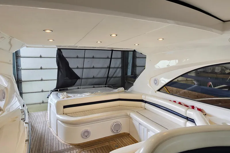 Slide: The Image of Interior of 2004 Sunseeker Camargue 50 yacht with elegant seating and modern lighting. - 12