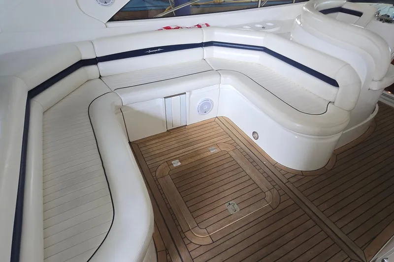 Slide: The Image of Luxurious seating area on 2004 Sunseeker Camargue 50 yacht with teak flooring. - 13