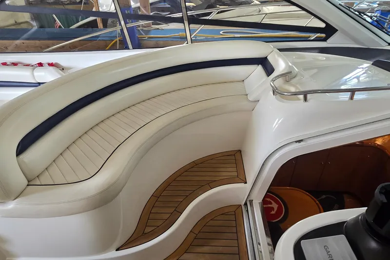 Slide: The Image of 2004 Sunseeker Camargue 50 yacht interior with elegant seating and teak flooring. - 22