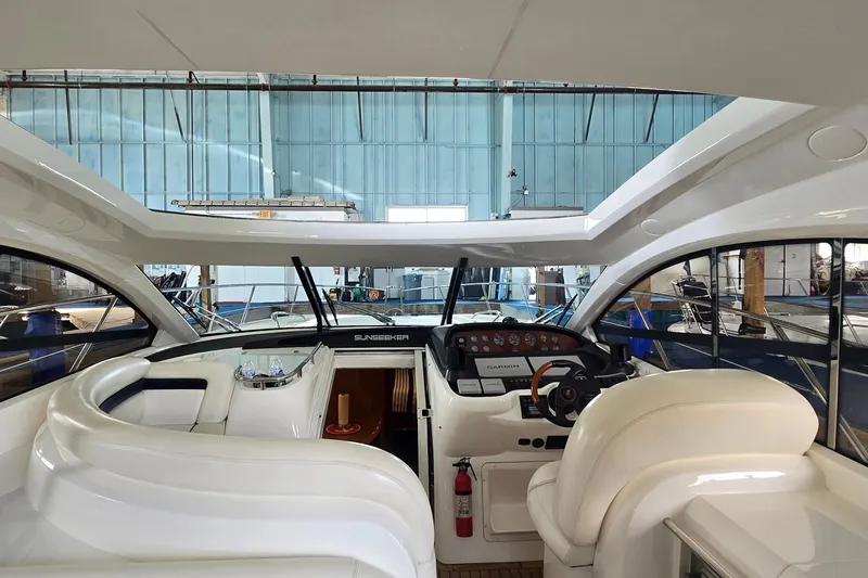 Slide: The Image of Interior view of 2004 Sunseeker Camargue 50 yacht with helm and seating area. - 24