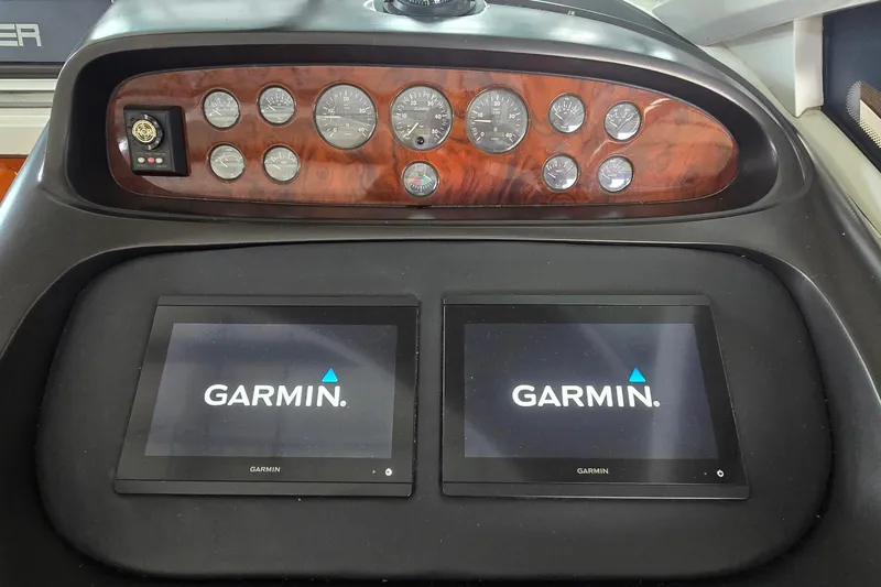 Slide: The Image of Dashboard of 2004 Sunseeker Camargue 50 with Garmin navigation displays and analog gauges. - 26