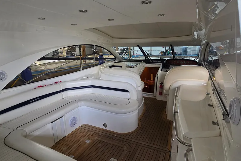 Slide: The Image of Luxurious interior of a 2004 Sunseeker Camargue 50 yacht with elegant seating and wood flooring. - 28