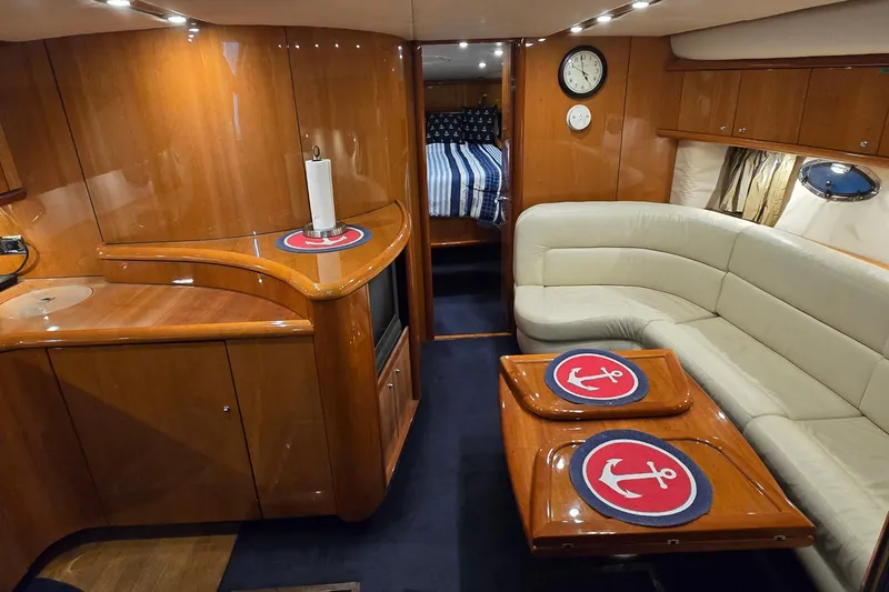 Slide: The Image of Luxurious interior of 2004 Sunseeker Camargue 50 yacht with elegant wood finish and cozy seating. - 29